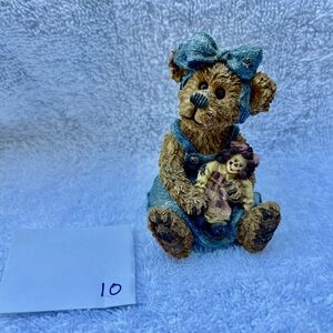 Boyd’s bear holding a doll